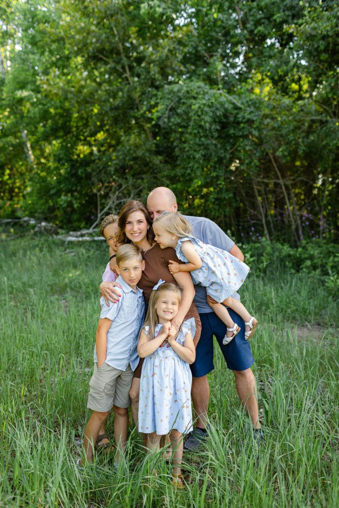 Family picture outdoors in grass